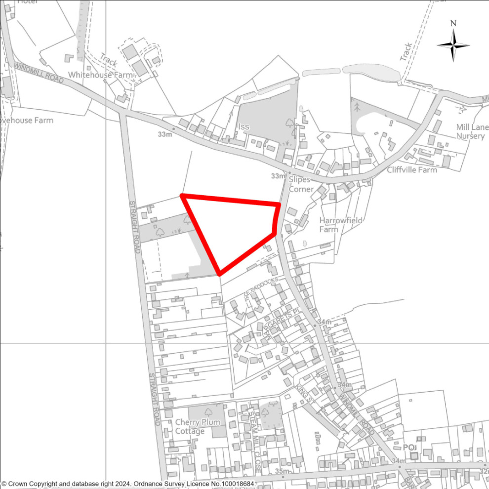 Map highlighting a triangular area in red near Straight Road, between Slipes Corner and Windmill Road, surrounded by buildings and labelled landmarks.