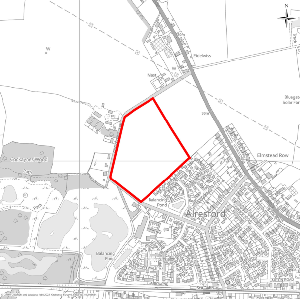 A grayscale map showing the boundary of the Land east of Cockaynes Lane, Alresford with a red outline. 