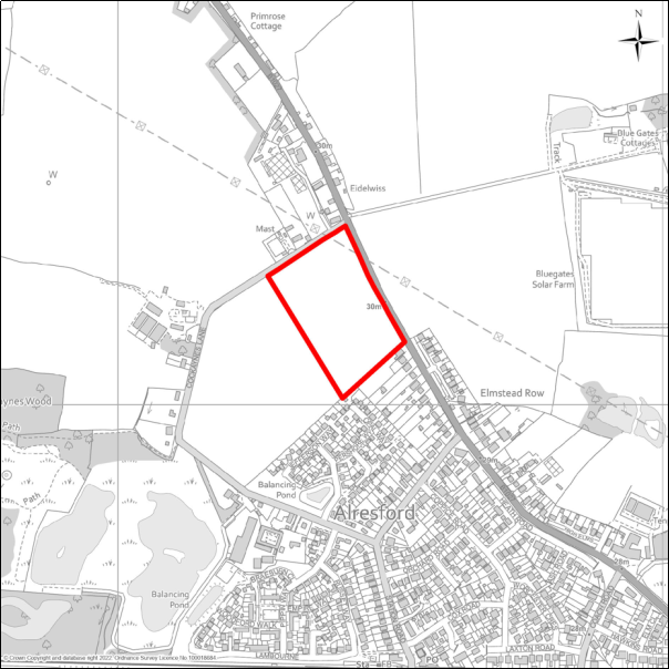 A grayscale map showing the boundary of the Land south-west of Colchester Main Road, Alresford with a red outline. 