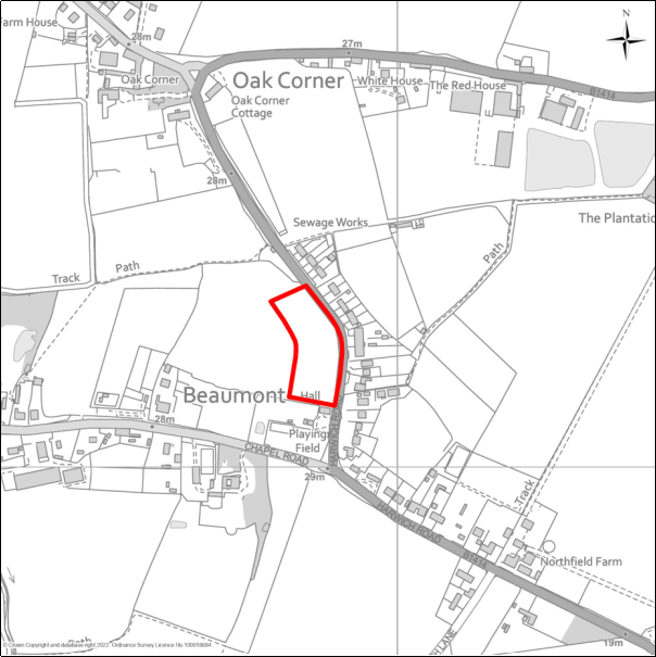 A grayscale map showing the boundary of the Land adjacent Village Hall, Harwich Road, Beaumont with a red outline. 
