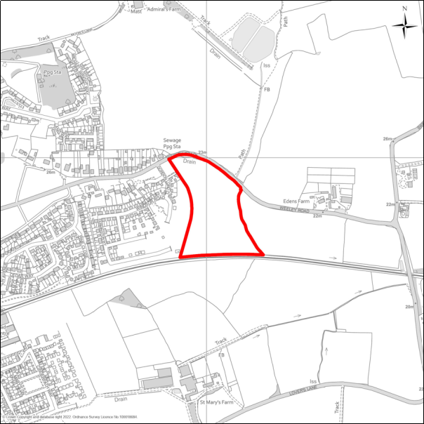 A grayscale map showing the boundary of the Land south of Weeley Road, Great Bentley with a red outline. 
