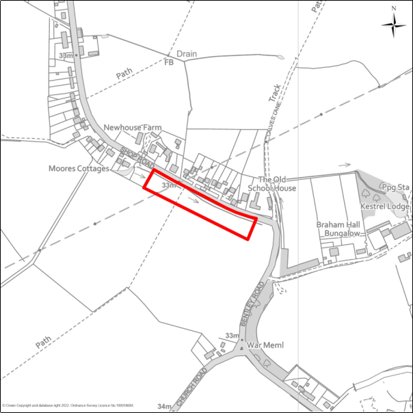 A grayscale map showing the boundary of the Land south of Shop Road, Little Bromley with a red outline. 