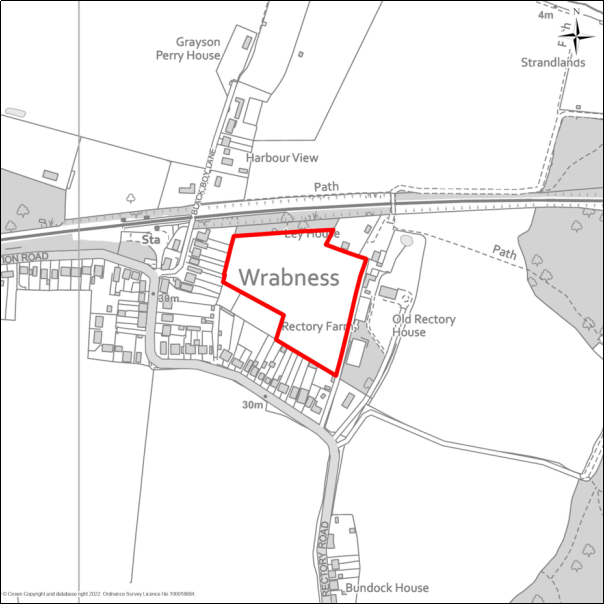 A grayscale map showing the boundary of the Land north of Rectory Road, Wrabness with a red outline. 