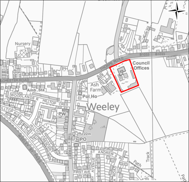 A grayscale map showing the boundary of the Land at Weeley Council Offices with a red outline. 