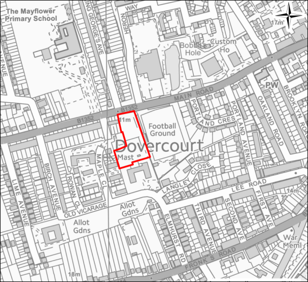 A grayscale map showing the boundary of the Land adjoining Harwich & Parkeston Football Club, Dovercourt with a red outline. 
