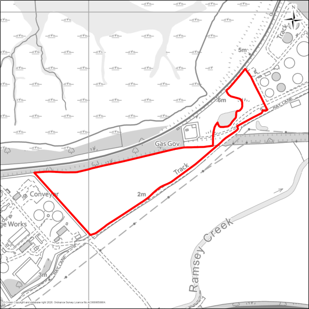 A grayscale map showing the boundary of the Carless Extension, Harwich with a red outline. 